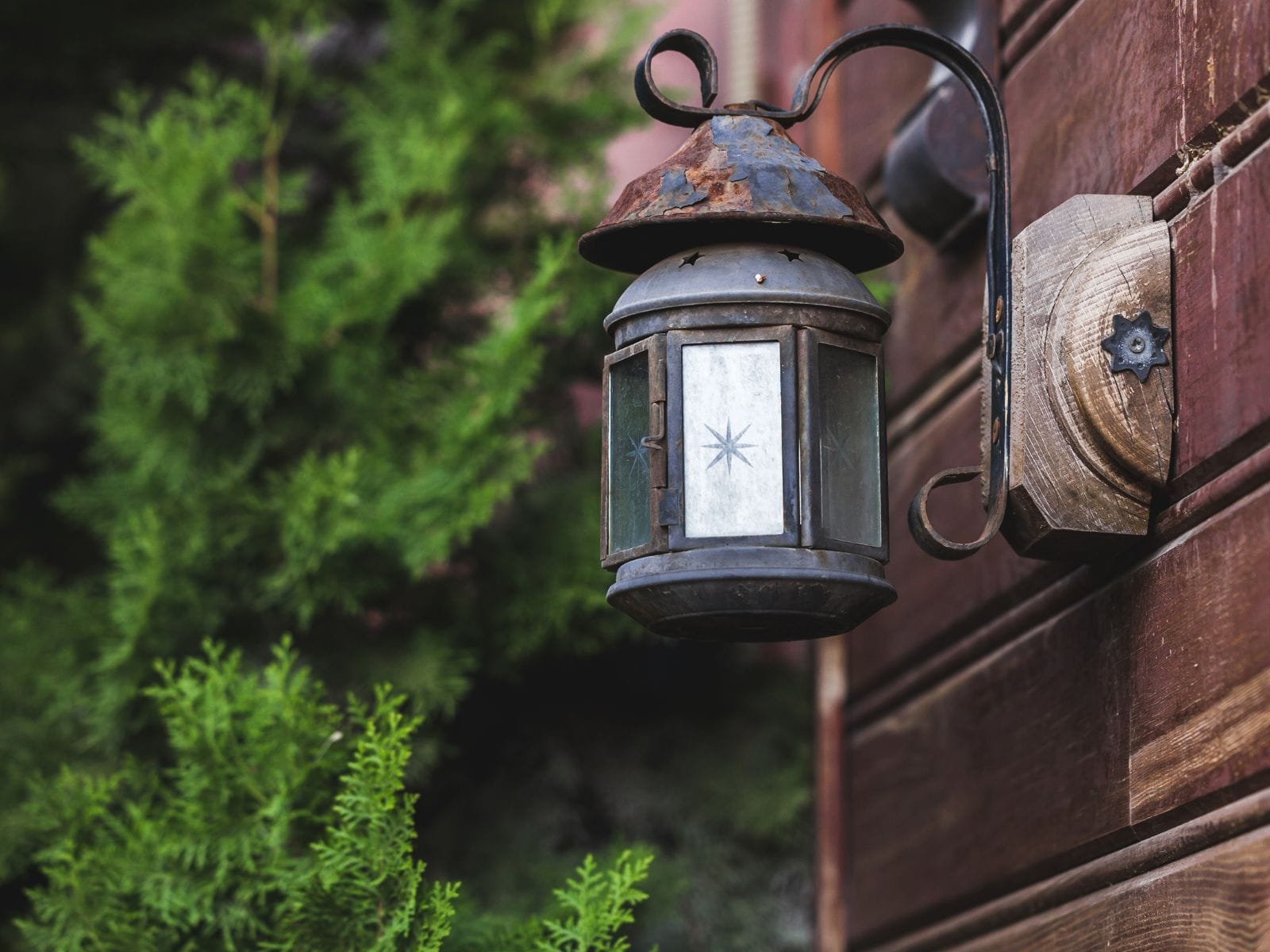 A wall sconce installed on a garden wall for landscaping purpose 